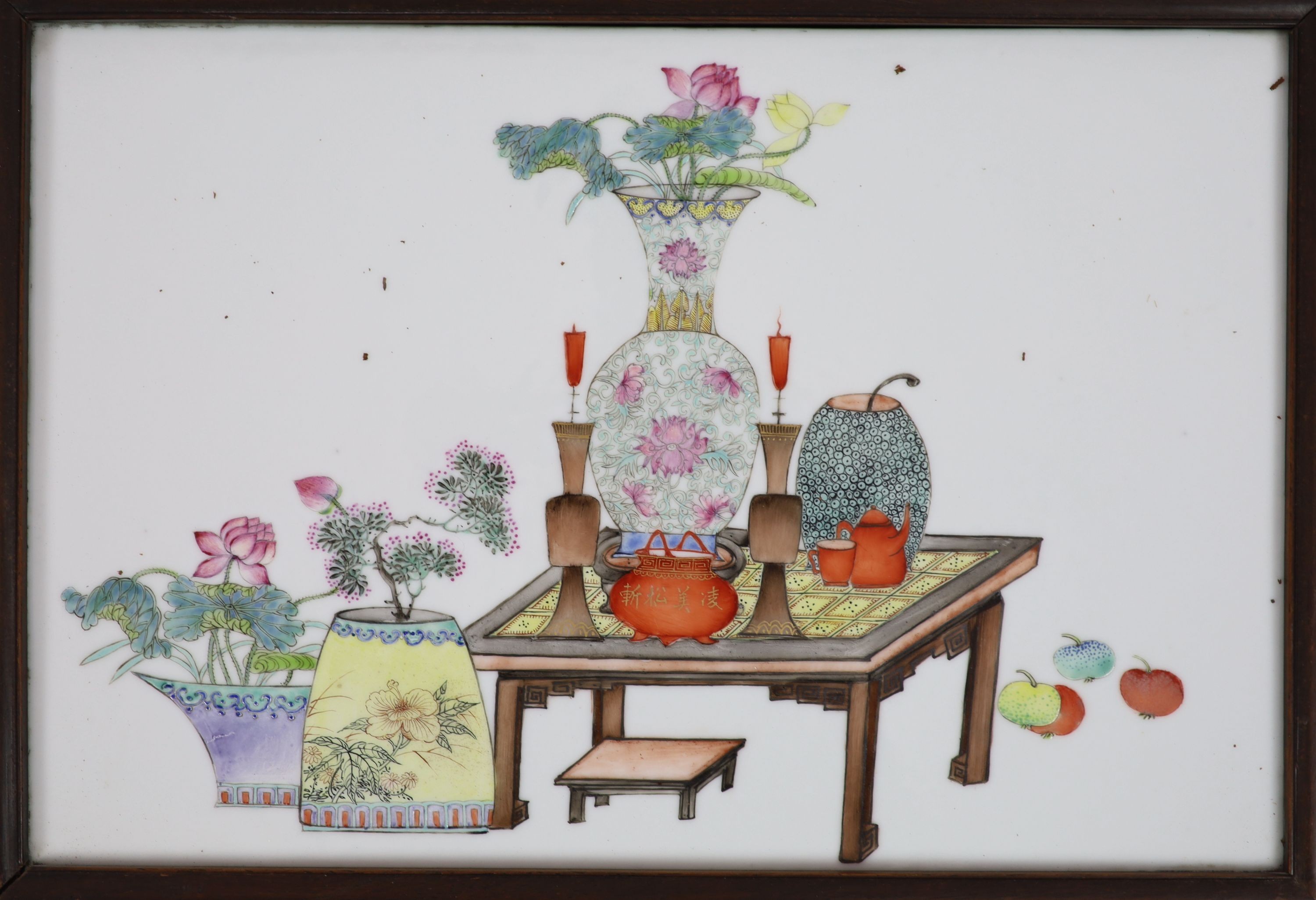 A set of four Chinese famille rose 'Hundred Antiques' plaques, late Qing dynasty, porcelain 26cm x 39cm, in hongmu and silk frames with jichimu insets to the back